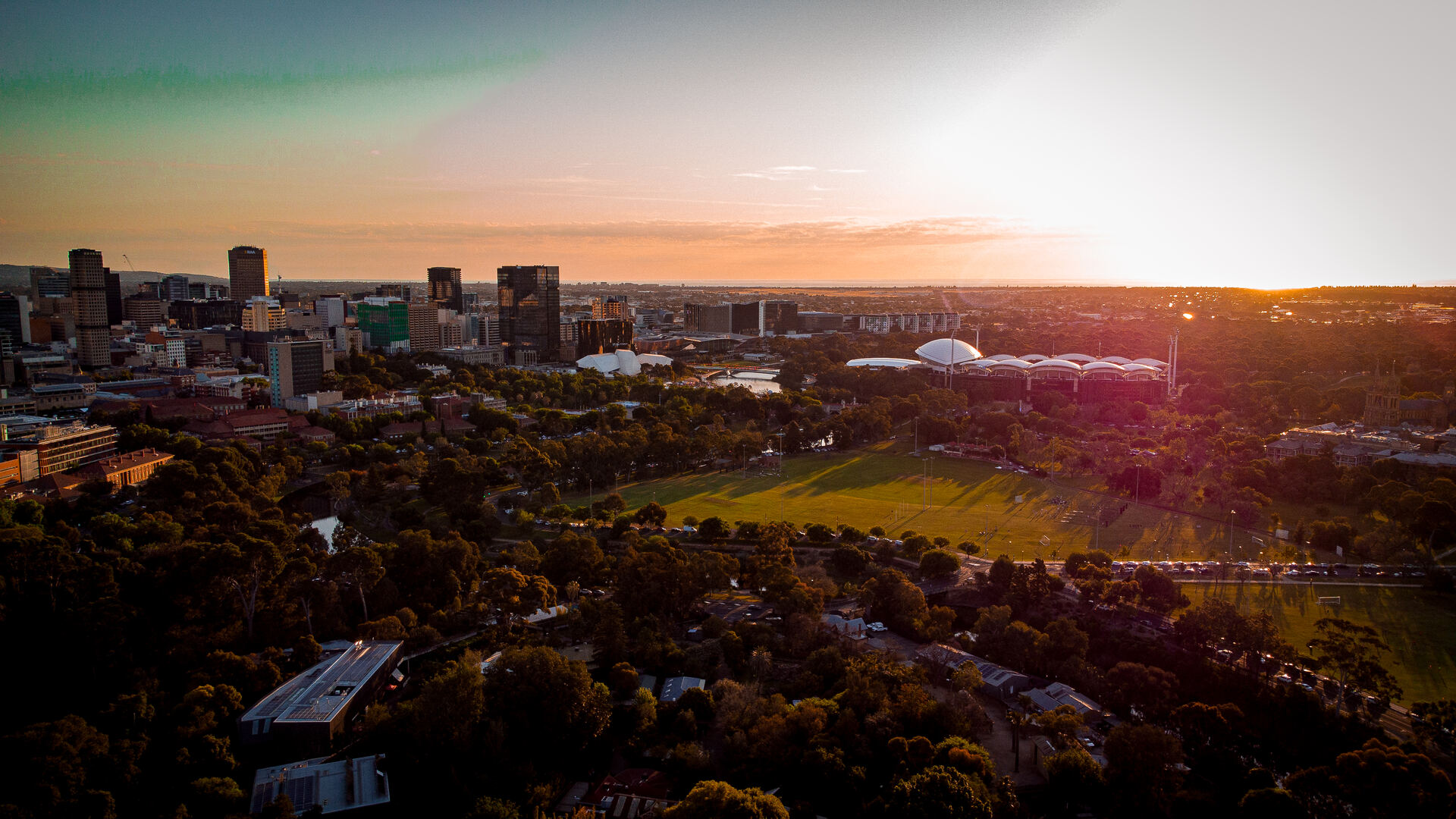 Adelaide skyline panorama at sunset with Adelaide Oval visible