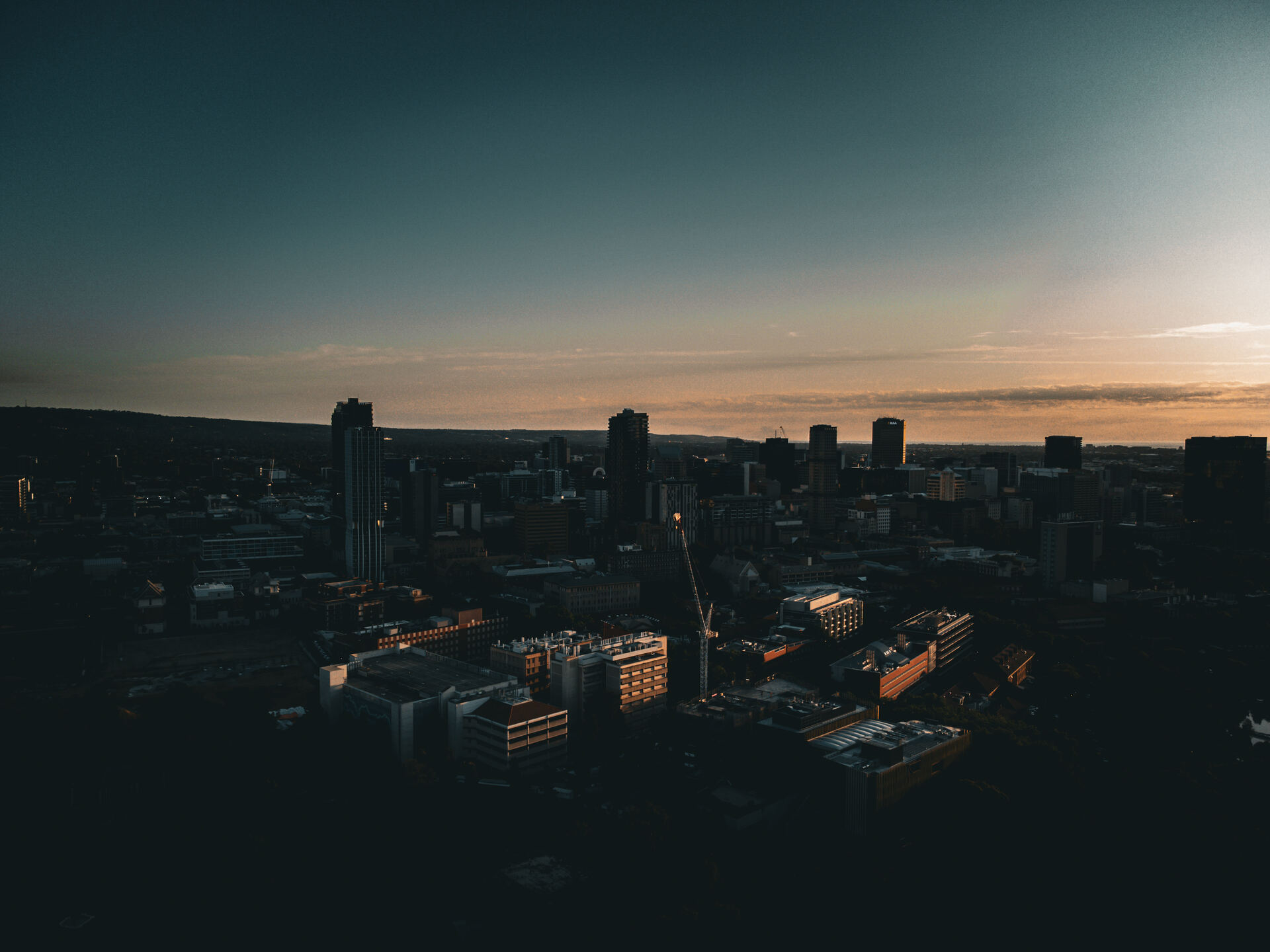 Aerial drone view of Adelaide CBD skyline at dusk