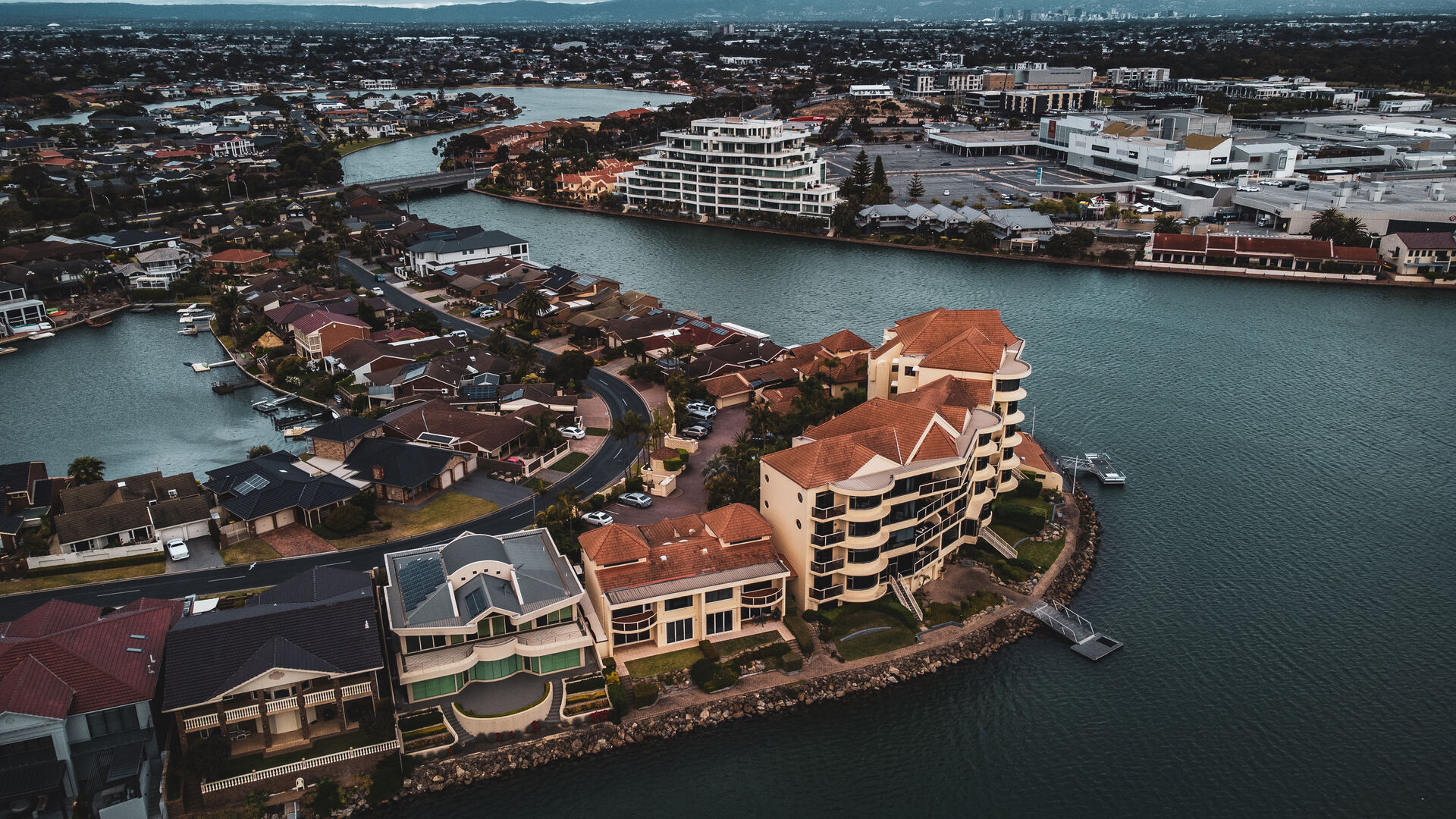 Aerial view of waterfront properties and harbour in Adelaide